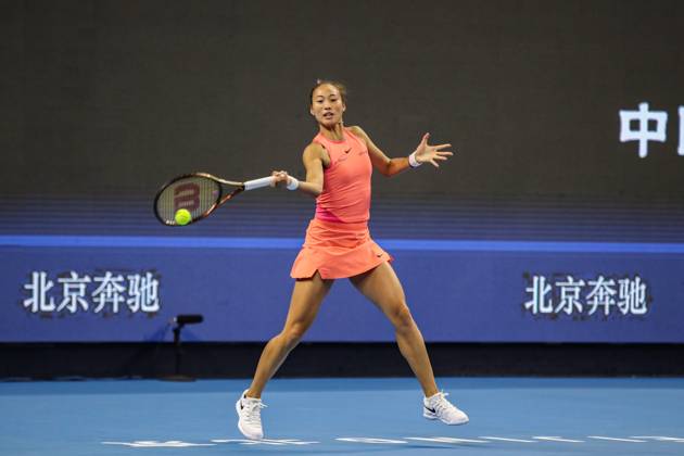 (241002) -- BEIJING, Oct. 2, 2024 -- Zheng Qinwen hits a return during the women s singles round of 16 match between Amanda Anisimova of the United States and Zheng Qinwen of China at the 2024 China Open tennis tournament in Beijing, China, Oct. 2, 2024. (Photo by Xinhua) (SP)CHINA-BEIJING-TENNIS-CHINA OPEN-WOMEN S SINGLES(CN) ChangxNengjia