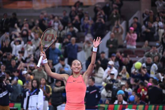 (241004) -- BEIJING, Oct. 4, 2024 -- Zheng Qinwen celebrates victory after the women s singles quarterfinal match between Zheng Qinwen of China and Mirra Andreeva of Russia at the 2024 China Open tennis tournament in Beijing, China, Oct. 4, 2024. ) (SP)CHINA-BEIJING-TENNIS-CHINA OPEN-WOMEN S SINGLES(CN) ZhangxLong