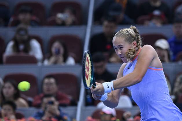 (241004) -- BEIJING, Oct. 4, 2024 -- Mirra Andreeva hits a return during the women s singles quarterfinal match between Zheng Qinwen of China and Mirra Andreeva of Russia at the 2024 China Open tennis tournament in Beijing, China, Oct. 4, 2024. ) (SP)CHINA-BEIJING-TENNIS-CHINA OPEN-WOMEN S SINGLES(CN) ZhangxLong