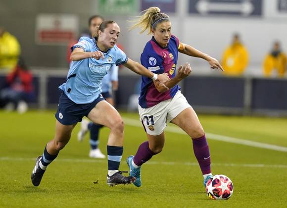 Manchester, England, 9th October 2024. Alexia Putellas of Barcelona (R) is challenged by Naomi Layzell of Manchester City during the UEFA Womens Champions League match at the Academy Stadium, Manchester. Picture credit should read: Andrew Yates Sportimage EDITORIAL USE ONLY. No use with unauthorised audio, video, data, fixture lists, club league logos or live services. Online in-match use limited to 120 images, no video emulation. No use in betting, games or single club league player publications. SPI-3368-0006