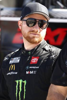 CHARLOTTE, NC - OCTOBER 12: Tyler Reddick ( 45 23XI Racing Monster Energy Toyota) talks with members of his crew during practice for the NASCAR, Motorsport, USA Cup Series Bank of America ROVAL 400 on October 12, 2024 at Charlotte Motor Speedway in Charlotte, NC. (Photo by Jeff Robinson Icon Sportswire) AUTO: OCT 12 NASCAR Cup Series Bank of America ROVAL 400 EDITORIAL USE ONLY Icon2410122402400