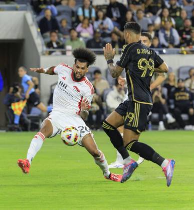 October 19, 2024, Los Angeles, California, USA: Denis Bouanga 99 of the Los Angeles Football Club is defended by Rodrigues 26 of the San Jose Earthquakes during their regular season MLS, Fussball Herren, USA match on Saturday October 19, 2024 at the BMO Stadium in Los Angeles, California. LAFC defeats Earthquakes, 3-1. JAVIER ROJAS PI Los Angeles USA - ZUMAp124 20241019_zaa_p124_051 Copyright: xJavierxRojasx