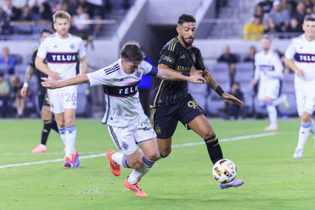 October 27, 2024, Los Angeles, California, USA: Denis Bouanga 99 of the Los Angeles Football Club and Ryan Gauld 25 of the Vancouver Whitecaps struggle for possession of the ball during the Audi 2024 MLS, Fussball Herren, USA Cup Playoffs Round One Game 1 of 3 on Sunday October 27, 2024 at BMO Stadium in Los Angeles, California. LAFC defeats Whitecaps, 2-1. ARIANA RUIZ PI Los Angeles U.S - ZUMAp124 20241027_zaa_p124_047 Copyright: xArianaxRuizx