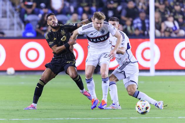 October 27, 2024, Los Angeles, California, USA: Denis Bouanga 99 of the Los Angeles Football Club attempts to steal the ball from Stuart Armstrong 26 of the Vancouver Whitecaps during the Audi 2024 MLS, Fussball Herren, USA Cup Playoffs Round One Game 1 of 3 on Sunday October 27, 2024 at BMO Stadium in Los Angeles, California. LAFC defeats Whitecaps, 2-1. ARIANA RUIZ PI Los Angeles U.S - ZUMAp124 20241027_zaa_p124_048 Copyright: xArianaxRuizx