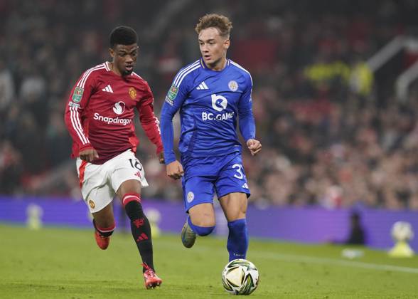 Manchester, England, 30th October 2024. Amad Diallo of Manchester United, ManU runs down Will Alves of Leicester City during the Carabao Cup match at Old Trafford, Manchester. Picture credit should read: Andrew Yates Sportimage EDITORIAL USE ONLY. No use with unauthorised audio, video, data, fixture lists, club league logos or live services. Online in-match use limited to 120 images, no video emulation. No use in betting, games or single club league player publications. SPI-3418-0055