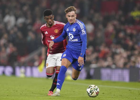 Manchester, England, 30th October 2024. Amad Diallo of Manchester United, ManU runs down Will Alves of Leicester City during the Carabao Cup match at Old Trafford, Manchester. Picture credit should read: Andrew Yates Sportimage EDITORIAL USE ONLY. No use with unauthorised audio, video, data, fixture lists, club league logos or live services. Online in-match use limited to 120 images, no video emulation. No use in betting, games or single club league player publications. SPI-3418-0056
