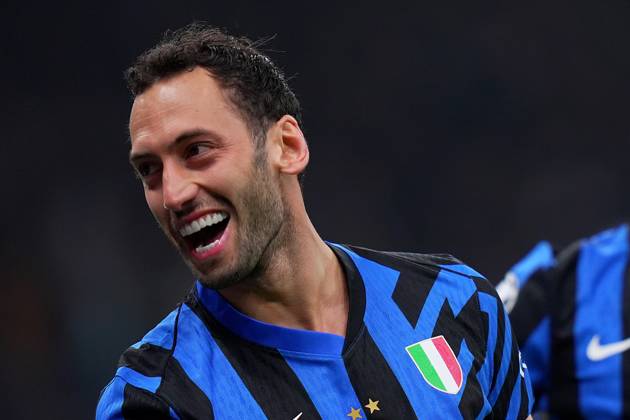 Inter Milan s Hakan Calhanoglu celebrates after scoring 2-0 during the Uefa Champions League soccer match between Inter and Feyenoord at the San Siro Stadium in Milan, north Italy - Tuesday , March 11 , 2025. - Soccer . Copyright: xSpada LaPressex