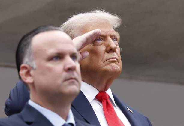 President Donald Trump salutes during the playing of the National Anthem before Jannik Sinner of Italy plays Carlos Alcaraz of Spain in the Men s Finals of the 2025 US Open Tennis Championship in Arthur Ashe Stadium at the USTA Billie Jean King National Tennis Center in Flushing Meadows, New York, on Sunday, September 7, 2025.  NYP20250907116 COREYxSIPKIN