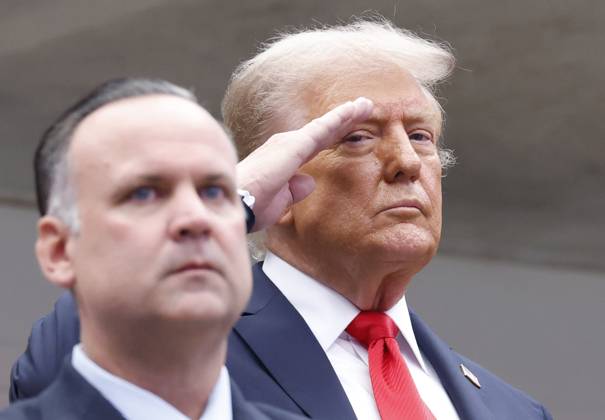 President Donald Trump salutes during the playing of the National Anthem before Jannik Sinner of Italy plays Carlos Alcaraz of Spain in the Men s Finals of the 2025 US Open Tennis Championship in Arthur Ashe Stadium at the USTA Billie Jean King National Tennis Center in Flushing Meadows, New York, on Sunday, September 7, 2025.  NYP20250907117 COREYxSIPKIN