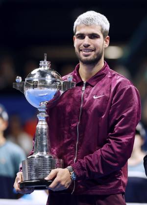 Tennis: Japan Open Carlos Alcaraz of Spain poses with the victor s trophy after winning the men s singles title at the Japan Open tennis tournament at Ariake Coliseum in Tokyo on Sept. 30, 2025. A14AA0004897123P