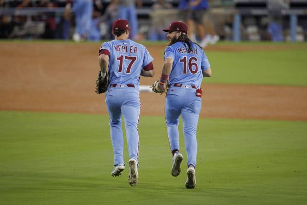 October 8, 2025, Los Angeles, California, USA: Max Kepler 17 of the Philadelphia Phillies is congratulated by Brandon Marsh 16 after catching a ball hit by Shohei Ohtani 17 of the Los Angeles Dodgers in the 9th inning during their MLB, Baseball Herren, USA National League Division Series Game 3 on Wednesday October 8, 2025 at Dodger Stadium in Los Angeles, California. Dodgers lose to Phillies, 2-8. ARMANDO ARORIZO PI Los Angeles USA - ZUMAp124 20251008_zaa_p124_033 Copyright: xArmandoxArorizox