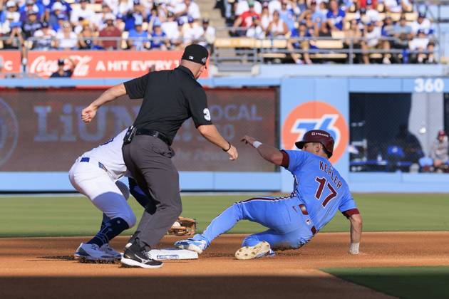 October 9, 2025, Los Angeles, California, USA: Max Kepler 17 of the Philadelphia Phillies slides safely into second base on a late tag by Mookie Betts 50 of the Los Angeles Dodgers during their MLB, Baseball Herren, USA National League Division Series Game 4 on Thursday October 9, 2025 at Dodger Stadium in Los Angeles, California. Dodgers defeat Phillies, 2-1 in ten innings to win the NLDS. JAVIER ROJAS PI Los Angeles USA - ZUMAp124 20251009_zaa_p124_050 Copyright: xJavierxRojasx