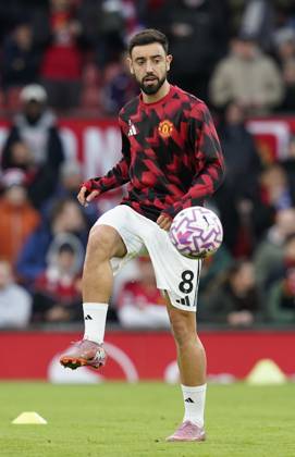 Manchester, England, 25th October 2025. Bruno Fernandes of Manchester United, ManU warms up on his 300th appearance before the Manchester United vs Brighton and Hove Albion Premier League match at Old Trafford, Manchester. Picture credit should read: Andrew Yates Sportimage EDITORIAL USE ONLY. No use with unauthorised audio, video, data, fixture lists, club league logos or live services. Online in-match use limited to 120 images, no video emulation. No use in betting, games or single club league player publications. SPI_011_AY_Man_Utd_Brighton SPI-4237-0010