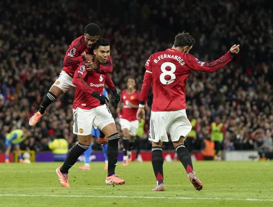 Manchester, England, 25th October 2025. Amad Diallo of Manchester United, ManU jumps up onto Casemiro of Manchester United as he celebrates after his shot was deflected into the goal by Yasin Ayari of Brighton for their second goal during the Manchester United vs Brighton and Hove Albion Premier League match at Old Trafford, Manchester. Picture credit should read: Andrew Yates Sportimage EDITORIAL USE ONLY. No use with unauthorised audio, video, data, fixture lists, club league logos or live services. Online in-match use limited to 120 images, no video emulation. No use in betting, games or single club league player publications. SPI_042_AY_Man_Utd_Brighton SPI-4237-0044