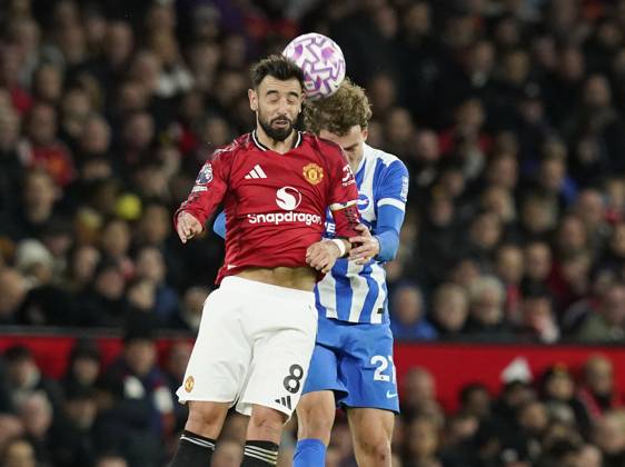 Manchester, England, 25th October 2025. Bruno Fernandes of Manchester United, ManU challenges Mats Wieffer of Brighton during the Manchester United vs Brighton and Hove Albion Premier League match at Old Trafford, Manchester. Picture credit should read: Andrew Yates Sportimage EDITORIAL USE ONLY. No use with unauthorised audio, video, data, fixture lists, club league logos or live services. Online in-match use limited to 120 images, no video emulation. No use in betting, games or single club league player publications. SPI_067_AY_Man_Utd_Brighton SPI-4237-0066