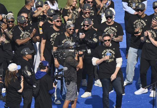 Los Angeles Dodgers first baseman Freddie Freeman (R) celebrates their World Series win with teammates following a parade at Dodger Stadium in Los Angeles on Monday, November 3, 2025. LAP2025110313 JIMxRUYMEN
