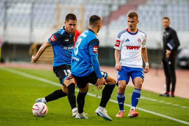 SuperSport HNL, round 15: HNK Hajduk Split v NK Varazdin Aleksa Latkovic of NK Varazdin and Simun Hrgovic of HNK Hajduk Split during the SuperSport HNL 2025. 2026. round 15 match between HNK Hajduk Split and NK Varazdin at Poljud Stadium in Split, Croatia on November 29, 2025. ZvonimirxBarisin PIXSELL