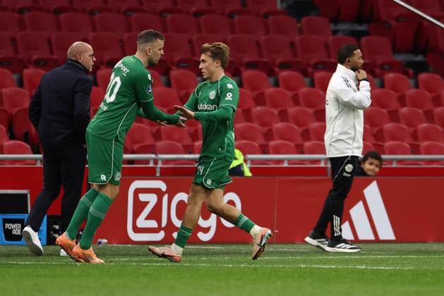 AMSTERDAM , 02-12-2025 , JohanCruyff Arena , season 2025 2026 , Dutch Eredivisie Football , match between Ajax and FC Groningen (replay) , Picture shows , .FC Groningen player Mats Seuntjens, .FC Groningen player Jorg Schreuders Ajax - Groningen (replay) x32313179x Copyright: