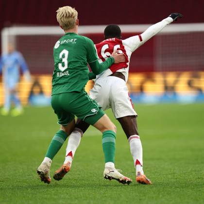 AMSTERDAM , 02-12-2025 , JohanCruyff Arena , season 2025 2026 , Dutch Eredivisie Football , match between Ajax and FC Groningen (replay) , Picture shows , FC Groningen player Thijmen Blokzijl, Ajax player Pharell Nash Ajax - Groningen (replay) x32313313x Copyright: