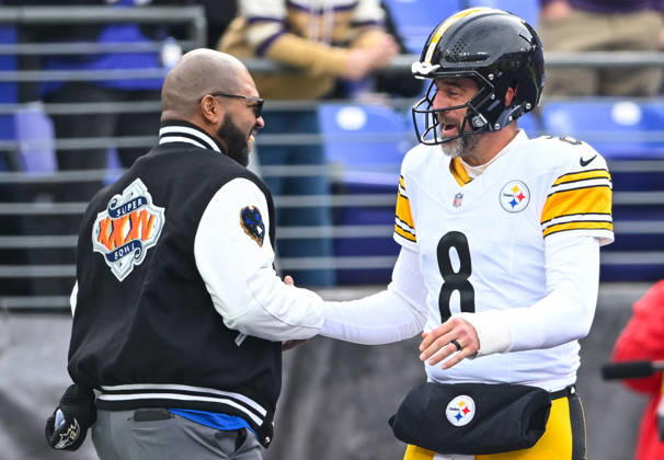 Pittsburgh Steelers quarterback Aaron Rodgers (8) greets an acquaintance during warmups before facing the Baltimore Ravens at M&T Bank Stadium in Baltimore, Maryland, on Sunday, December 7 2025.  BAL20251207104 DAVIDxTULIS