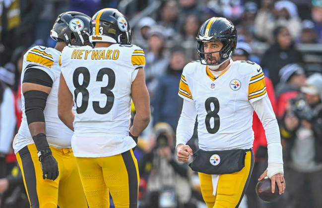 Pittsburgh Steelers quarterback Aaron Rodgers (8) clenches his fist after scoring on a one yard run against the Baltimore Ravens as tight end Connor Heyward (83) greets him during the first quarter at M&T Bank Stadium in Baltimore, Maryland, on Sunday, December 7 2025.  BAL20251207122 DAVIDxTULIS
