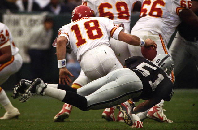 November 28, 1999 - Oakland, California, U.S - Oakland Raiders vs. Kansas City Chiefs at Oakland Alameda County Coliseum Sunday, November 29, 1999. Chiefs beat Raiders 37-34. Oakland Raiders defensive end Lance Johnstone (51) sacks Kansas City Chiefs quarterback Elvis Grbac Copyright: xAlxGolubx