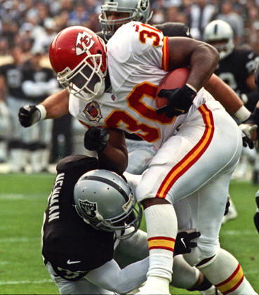 November 28, 1999 - Oakland, California, U.S - Oakland Raiders vs. Kansas City Chiefs at Oakland Alameda County Coliseum Sunday, November 29, 1999. Chiefs beat Raiders 37-34. Oakland Raiders defensive back Anthony Newman (30) tackles Kansas City Chiefs running back Donnell Bennett Copyright: xAlxGolubx