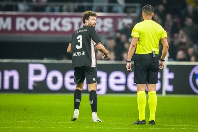 AMSTERDAM , 21-02-2026 , JohanCruyff Arena , season 2025 2026 , Dutch Eredivisie football , match between Ajax and NEC Nijmegen , picture shows NEC player Philippe Sandler and referee Jeroen Manschot Ajax - NEC x201794409x Copyright: