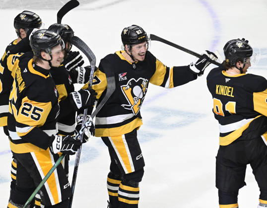 Pittsburgh Penguins right wing Rickard Rakell (67) celebrates his the overtime penalty shot goal in the Pittsburgh Penguins 5-4 win against the Winnipeg Jets at PPG Paints Arena in Pittsburgh on Saturday, March 21, 2026. PIT2026032114 ARCHIExCARPENTER
