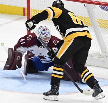 Pittsburgh Penguins right wing Rickard Rakell (67) scores on Colorado Avalanche goaltender Scott Wedgewood (41) in the third period of the Pittsburgh Penguins 6-2 lost at PPG Paints Arena in Pittsburgh on Tuesday, March 24, 2026. PIT2026032420 ARCHIExCARPENTER