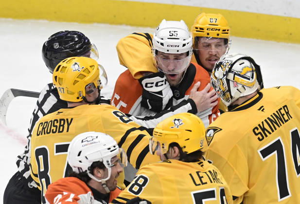 Pittsburgh Penguins right wing Rickard Rakell (67) holds back Philadelphia Flyers defenseman Rasmus Ristolainen (55) after fighting with Pittsburgh Penguins center Sidney Crosby (87) in the first period during game two in the opening round of the Eastern Conference playoffs between the Pittsburgh Penguins and Philadelphia Flyers at PPG Paints Arena in Pittsburgh on Monday, April 20, 2026. PIT2026042004 ARCHIExCARPENTER