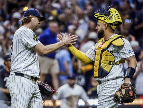 Milwaukee Brewers closing pitcher Trevor Megill (L) and Milwaukee Brewers catcher William Contreras celebrate after the final out in the ninth inning of the MLB, Baseball Herren, USA game between the Minnesota Twins and the Milwaukee Brewers at American Family Field in Milwaukee, Wisconsin on Saturday, August 8, 2026. The Brewers defeated the Twins 4-3. MIL20250808845 TANNENxMAURY