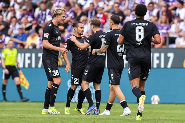 2026.08.15, xkwix, Fußball, 2. Bundesliga, VfL Osnabrück - 1. FC Magdeburg, Stadion an der Bremer Brücke, 2.Spieltag, Saison 2026 2027: Torjubel von Luka Hyrylaeinen (1. FC Magdeburg 38), Baris Atik (1. FC Magdeburg 23) und dem Torschuetzen Alexander Nollenberger (1. FC Magdeburg 17) bei 0:2 DFB regulations prohibit any use of photographs as image sequences and or quasi-video. Photo: xKamilxWilkowskixPressefotoKochx Niedersachsen Deutschland