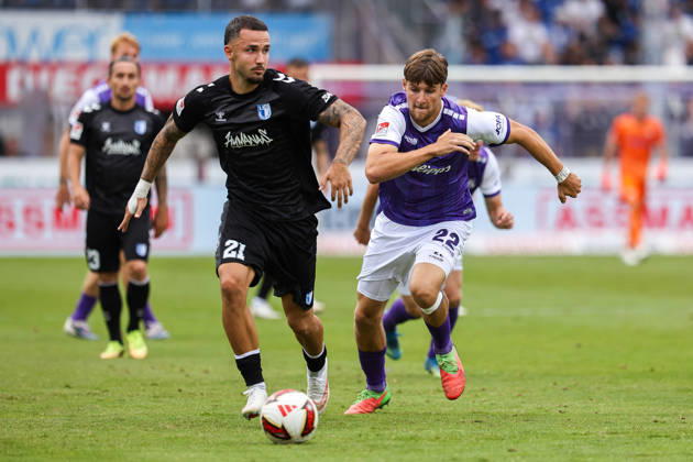 2026.08.15, xkwix, Fußball, 2. Bundesliga, VfL Osnabrück - 1. FC Magdeburg, Stadion an der Bremer Brücke, 2.Spieltag, Saison 2026 2027: Falko Michel (1. FC Magdeburg 21) im Zweikampf gegen Bernd Riesselmann (VfL Osnabrueck 22) DFB regulations prohibit any use of photographs as image sequences and or quasi-video. Photo: xKamilxWilkowskixPressefotoKochx Niedersachsen Deutschland