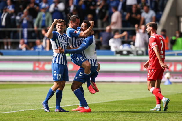 Torjubel - Torschütze Emmanuel Iyoha (1. FC Magdeburg,8) trifft zum 1-0 mit Baris Atik (1. FC Magdeburg,23) und Alexander Nollenberger (1. FC Magdeburg,17) - 2. Fußball Bundesliga Saison 2026-2027 1. FC Magdeburg vs 1. FC Kaiserslautern in der Avnet Arena in Magdeburg - Aktion,Fußball,Mann,Männer,Deutschland,12.09.2026
