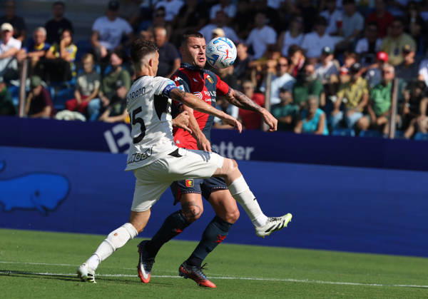 Genoa™s Milutin Osmajic fights for the ball with Parma™s Enrico Delprato during the Serie A soccer match between Parma and Genoa at the Ennio Tardini Stadium in Parma, north west Italy - September 20, 2026. - Soccer Copyright: xGiannixSantandrea LaPressex