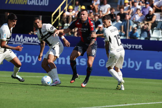 Genoa™s Milutin Osmajic fights for the ball with Parma™s Enrico Delprato and Emanuele Valeri during the Serie A soccer match between Parma and Genoa at the Ennio Tardini Stadium in Parma, north west Italy - September 20, 2026. - Soccer Copyright: xGiannixSantandrea LaPressex