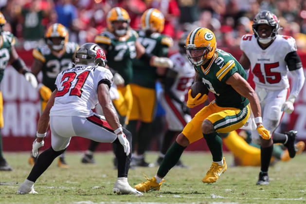 Oct 4, 2026; Tampa, FL, USA; Green Bay Packers wide receiver Christian Watson (9) attempts to avoid a tackle by Tampa Bay Buccaneers safety Antoine Winfield Jr. (31) after catching a pass during the NFL, American Football Herren, USA game between the Green Bay Packers and Tampa Bay Buccaneers at Raymond James Stadium. Mandatory Credit: Taylor McFee-Cal Media NFL 2026: Packers Vs Buccaneers OCT 04 - ZUMAc04_ 20261004_zma_c04_088 Copyright: xTaylorxMcfeex