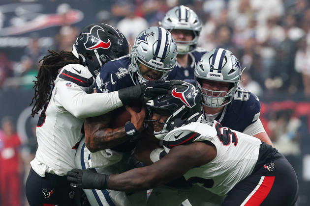 HOUSTON, TX - OCTOBER 04: Quarterback Dak Prescott 4 of the Dallas Cowboys is hit by defensive end Jadeveon Clowney 90 of the Houston Texans and defensive end Jaden Crumedy 95 of the Houston Texans during the NFL, American Football Herren, USA football game between the Houston Texans and Dallas Cowboys on October 4, 2026, at Reliant Stadium in Houston, TX. (Photo by David Buono Icon Sportswire) NFL: OCT 04 Cowboys at Texans EDITORIAL USE ONLY Icon241004142