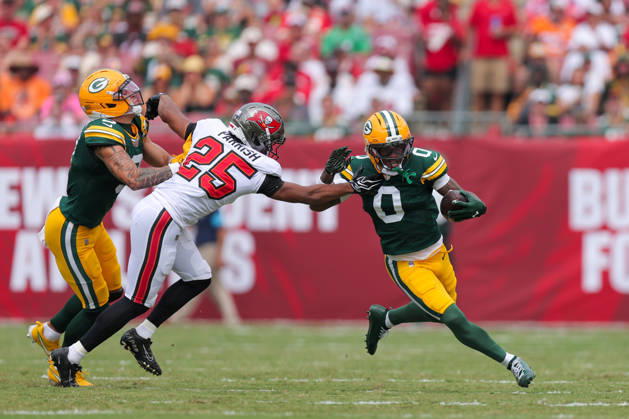 Oct 4, 2026; Tampa, FL, USA; Green Bay Packers wide receiver Matthew Golden (0) attempts to avoid a tackle by Tampa Bay Buccaneers cornerback Jacob Parrish (25) during the NFL, American Football Herren, USA game between the Green Bay Packers and Tampa Bay Buccaneers at Raymond James Stadium. Mandatory Credit: Taylor McFee-Cal Media Tampa USA - ZUMAc04_ 20261004_zma_c04_622 Copyright: xTaylorxMcfeex