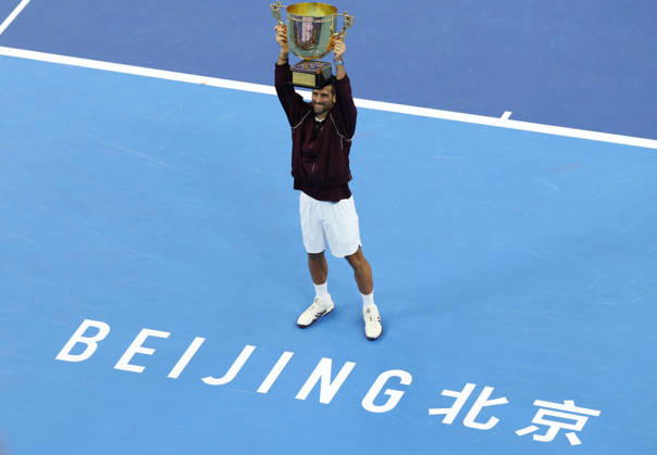 (261006) -- BEIJING, Oct. 6, 2026 -- Winner Novak Djokovic of Serbia holds up the champion trophy during the awarding ceremony for the men s singles final at 2026 China Open tennis tournament in Beijing, China, Oct. 6, 2026. ) (SP)CHINA-BEIJING-TENNIS-CHINA OPEN-MEN S SINGLES-AWARDING CEREMONY(CN) ZhangxChenlin