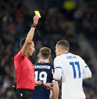 UK: Scotland v Slovenia, UEFA Nations League at Barclays Hampden, Glasgow, Scotland on 06 October 2026: Pictured: Zan Celar (Slovenia) receives a yellow card Glasgow Barclays Hampden Scotland Copyright: xAlexxToddx