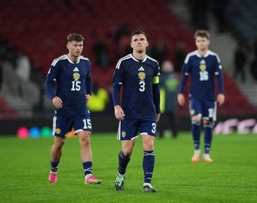Scotland captain Andy Robertson walks off the pitch at full-time flanked by Josh McPake & Findlay Curtis of Scotland. Final score Scotland 1 Slovenia 2. Scotland v Slovenia, Football, UEFA Nation s League, Group B1, Hampden Park, Glasgow, UK, Hampden Park, Glasgow, Scotland, Scotland, UK - 06 Oct 2026Glasgow Hampden Park Scotland United Kingdom Copyright: xStuartxWallace Shutterstockx 17189021cp