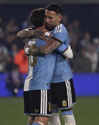 BUENOS AIRES, ARGENTINA - OCTOBER 06 : Forward Lionel Messi 10 of Argentina national team, Nationalteam high-fives teammate Nicolas Otamendi during an International Friendly, Länderspiel, Nationalmannschaft match against Benin at Estadio Monumental on October 06, 2026 in Buenos Aires, Argentina. This historic match marks the final international appearance who wore a commemorative special-edition kit replacing the traditional manufacturer branding with his personal signature logo. Photo by SFSI Argentina National team v Benin Copyright: xSFSIx
