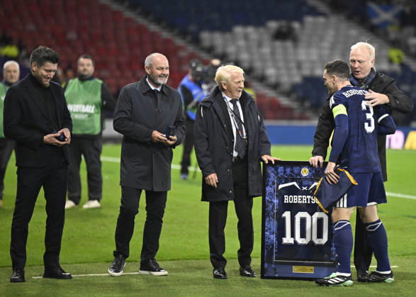 Glasgow, Scotland, 6th October 2026. Scotland head coach, Sebastien Pocognoli with former Scotland & Andy Robertsons managers Steve Clarke, Gordon Strachan and Alex McLeish wait to present a framed shiirt to mark Roberstons 100 cap during the Scotland vs Slovenia UEFA Nations League match at Hampden Park, Glasgow. Picture credit should read: Neil Hanna Sportimage EDITORIAL USE ONLY. No use with unauthorised audio, video, data, fixture lists, club league logos or live services. Online in-match use limited to 120 images, no video emulation. No use in betting, games or single club league player publications. SPI_093_NH_Scotland_Slovenia SPI-5054-0093