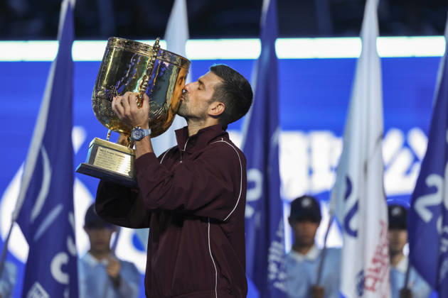 (261007) -- BEIJING, Oct. 7, 2026 -- Novak Djokovic of Serbia kisses the champion trophy during the awarding ceremony for the men s singles final at 2026 China Open tennis tournament in Beijing, China, Oct. 6, 2026. ) XINHUA PHOTOS OF THE DAY BaixXuefei