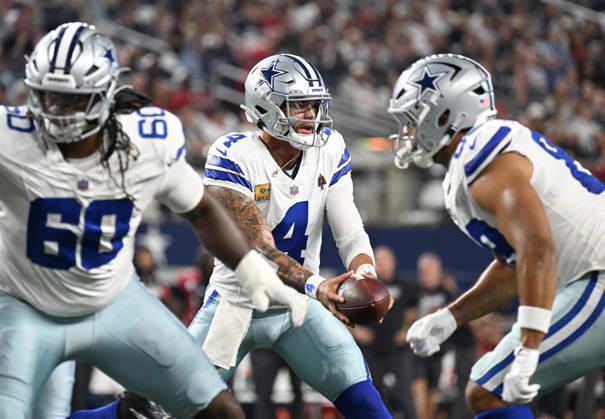 Dallas Cowboys Dak Prescott hands off against the Tampa Bay Buccaneers during their game at AT&T Stadium in Arlington, Texas on Thursday, October 8, 2026.  ARL2026100812 IANxHALPERIN