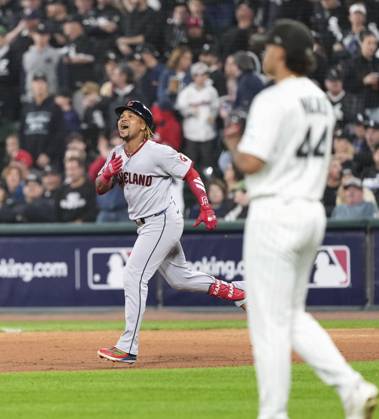 Baseball: Division Series between Guardians and White Sox Jose Ramirez (L) of the Cleveland Guardians celebrates after hitting a two-run home run as Chicago White Sox pitcher Hagen Smith (44) looks on in the fifth inning of Game 4 of the American League Division Series against the at Rate Field in Chicago on Oct. 8, 2026. A14AA0005630521P