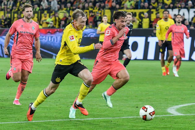 v. li. im Zweikampf Maximilian Beier (Dortmund 14) Olivier Deman (Bremen 2) 09.10.2026 ¢ Fussball ¢ Borussia Dortmund vs SV Werder Bremen, Signal Iduna Park, Dortmund, DFB DFL REGULATIONS PROHIBIT ANY USE OF PHOTOGRAPHS AS IMAGE SEQUENCES AND OR QUASI-VIDEO NRW Germany