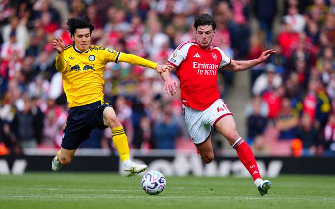 Ao Tanaka of Leeds United tackles Declan Rice of Arsenal Arsenal v Leeds United, Premier League, Football, Emirates Stadium, London, UK - 10 Oct 2026London Emirates Stadium United Kingdom EDITORIAL USE ONLY No use with unauthorised audio, video, data, fixture lists, club league logos or live services. Online in-match use limited to 120 images, no video emulation. No use in betting, games or single club league player publications.  Copyright: xJavierxGarcia Shutterstockx 17204400v